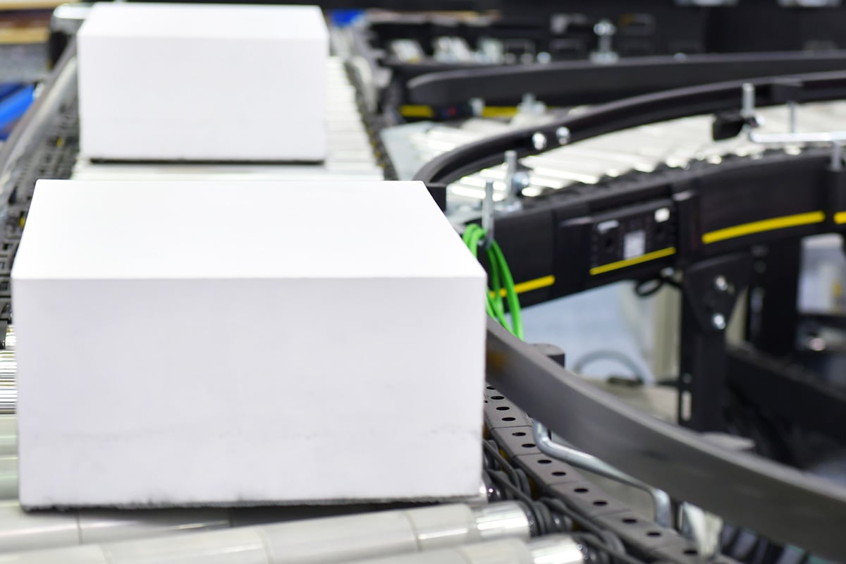boxes on conveyor belt in healthcare warehouse