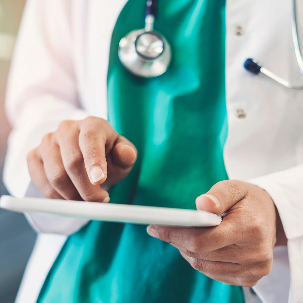 doctor using digital tablet