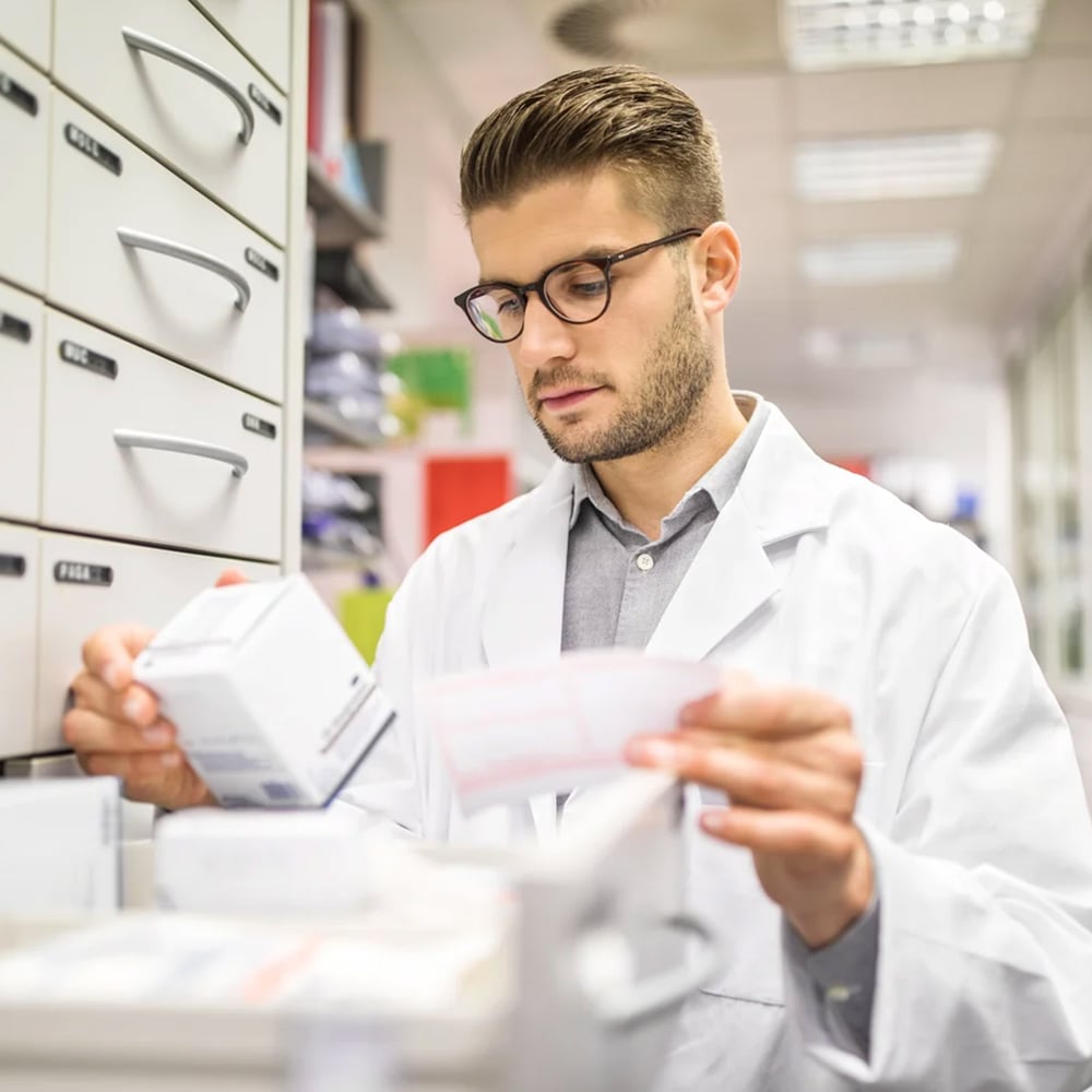Pharmacist checking medication 