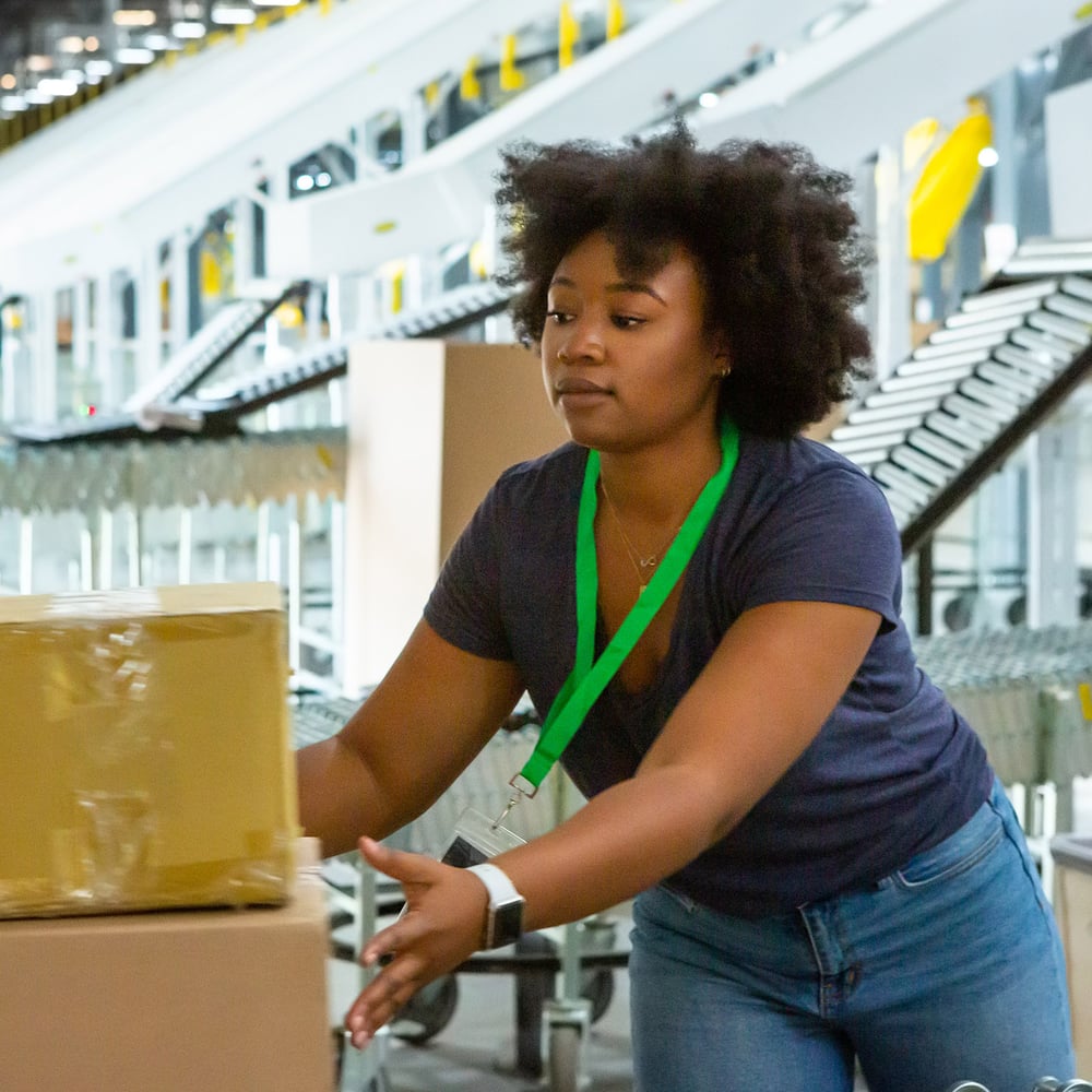 worker loading boxes in warehouse