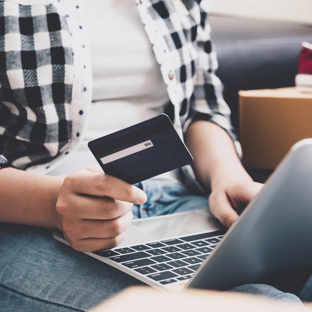 customer using credit card on e-commerce website