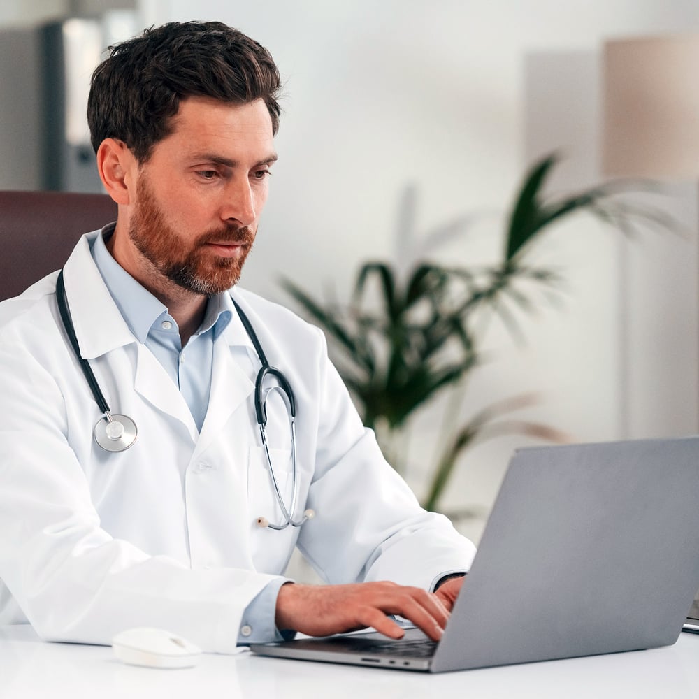 Doctor using computer at work