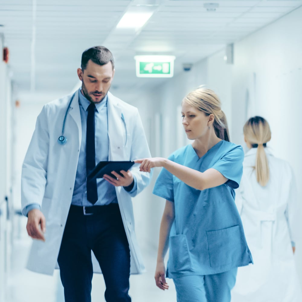Medical professionals walking in hospital hallway