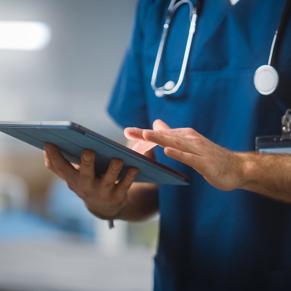 Doctor using digital tablet