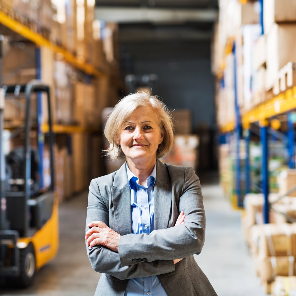 Business woman looking confident in warehouse