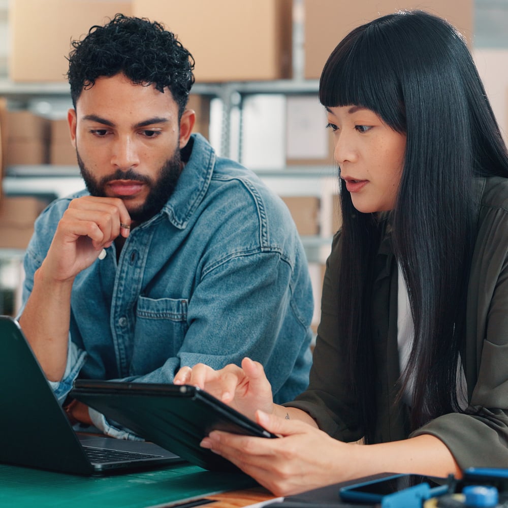 Managers adjusting fulfillment process on computer