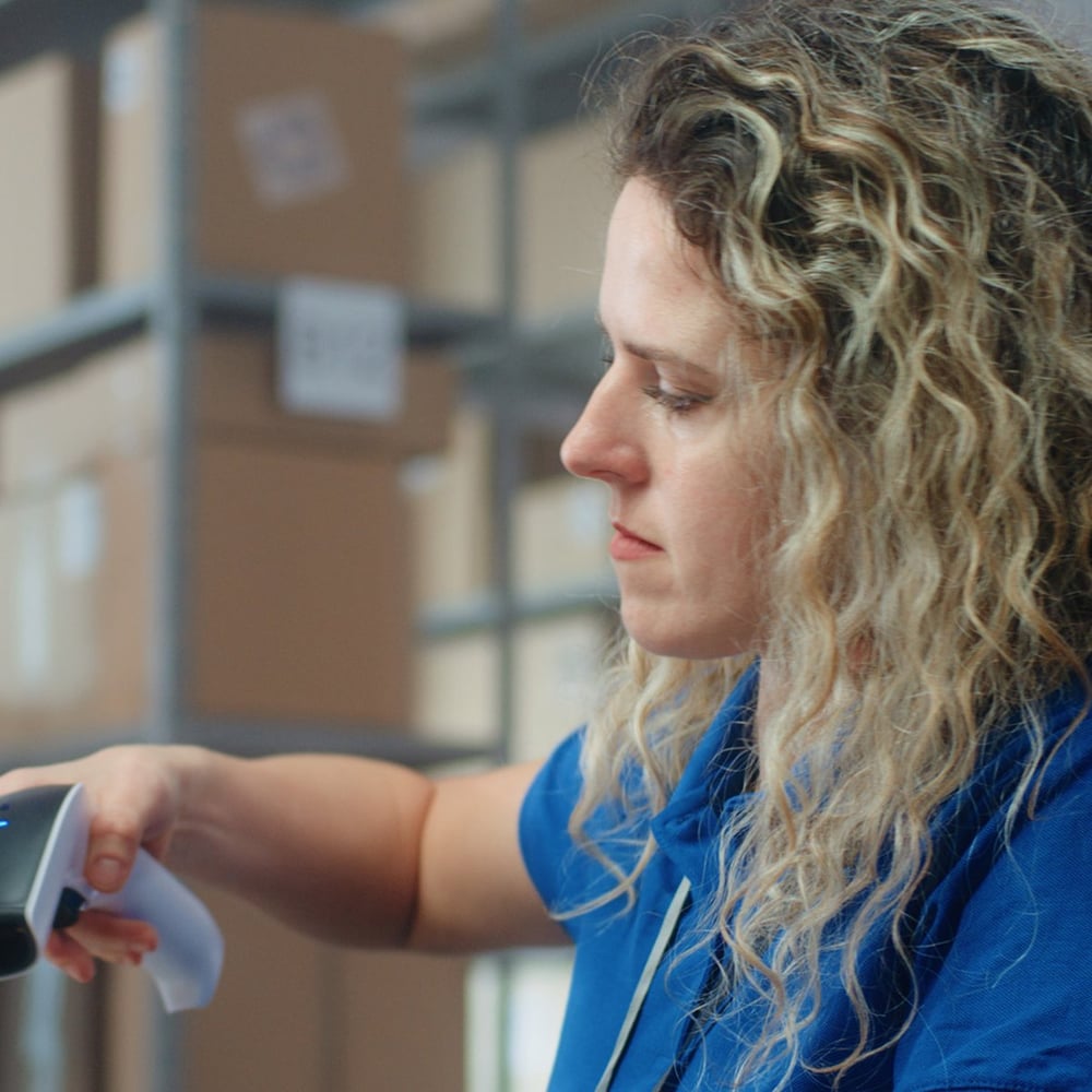 Logistics specialist scans parcel