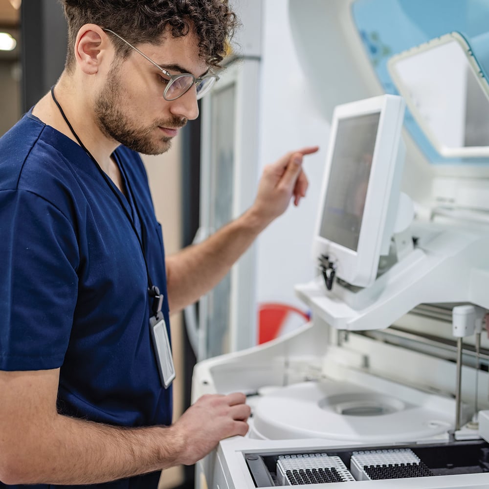 Lab technician using advanced medical equipment