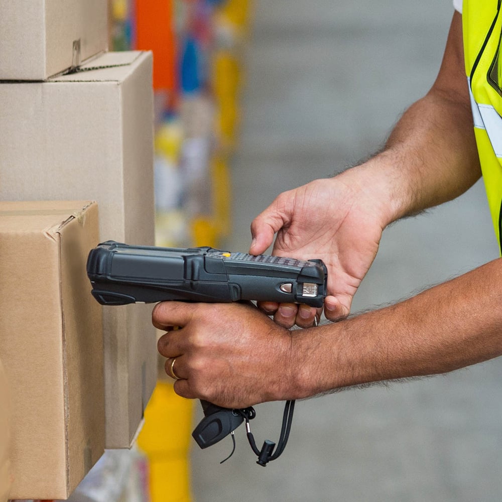 Warehouse worker scanning box