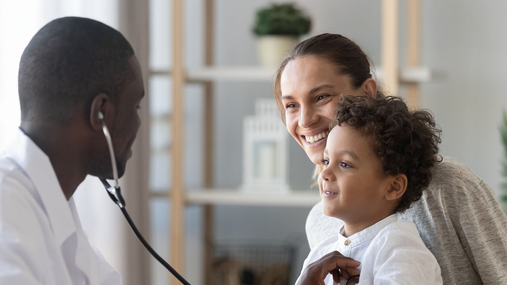pediatrician hold stethoscope exam child boy patient