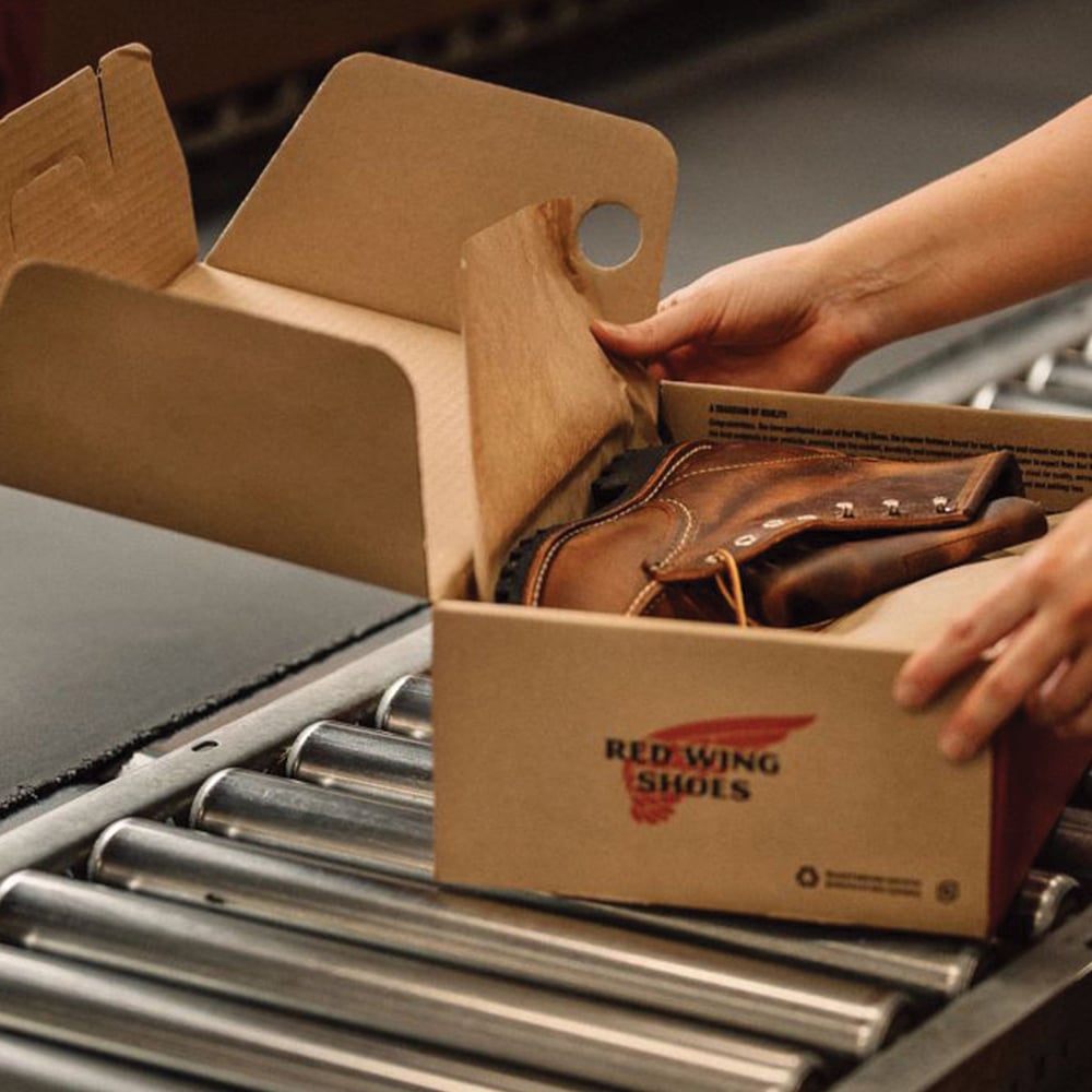 red wing shoes box on conveyor belt