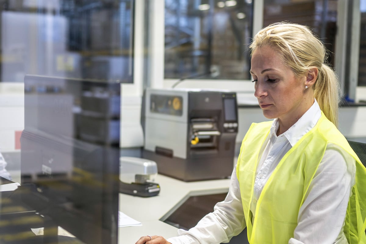 warehouse manager working on desktop