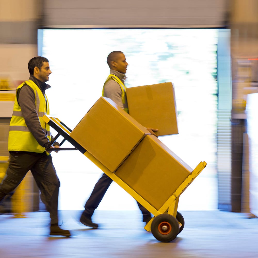 workers moving boxes in loading dock
